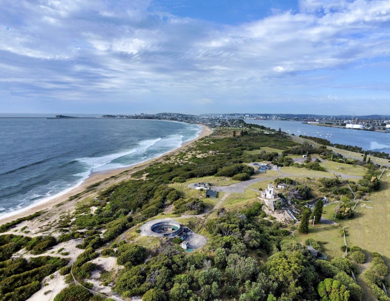 Breathtaking aerial view of Stockton Beach coastline and greenery in NSW, Australia.